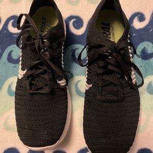 Nike motion free run flyknit sneakers.